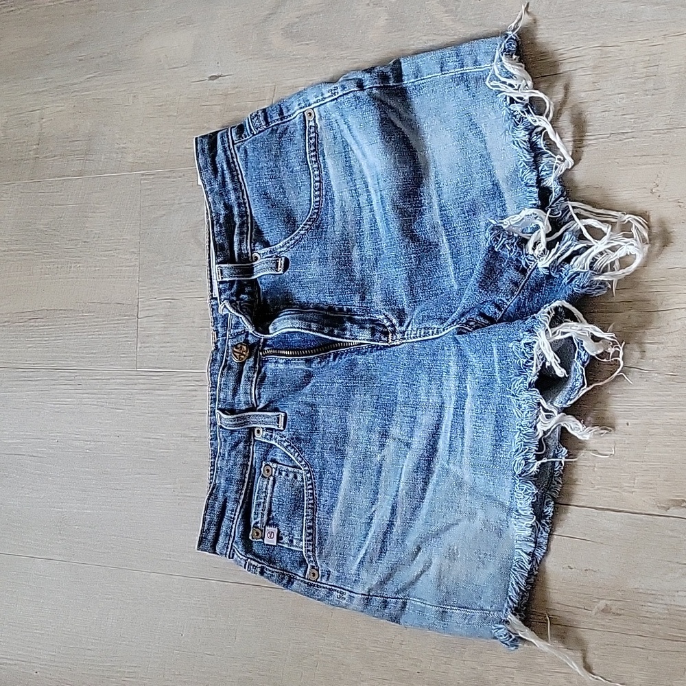 AG frayed hem denim shorts size 26R in light blue wash.